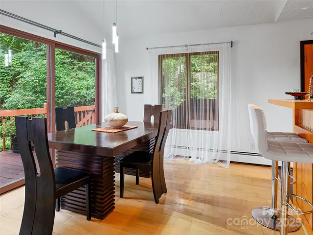 a dining room with furniture window wooden floor