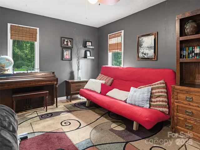 a bedroom with furniture and a window