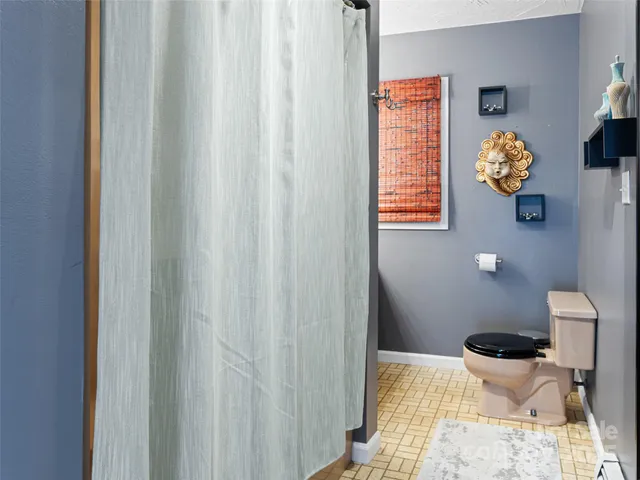 a bathroom with a toilet and a sink