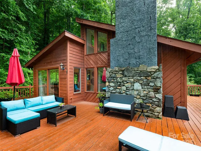 a view of a lounge chairs in back yard of the house