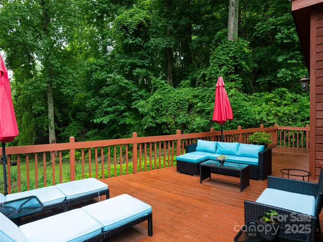a view of a deck with a chair and wooden floor