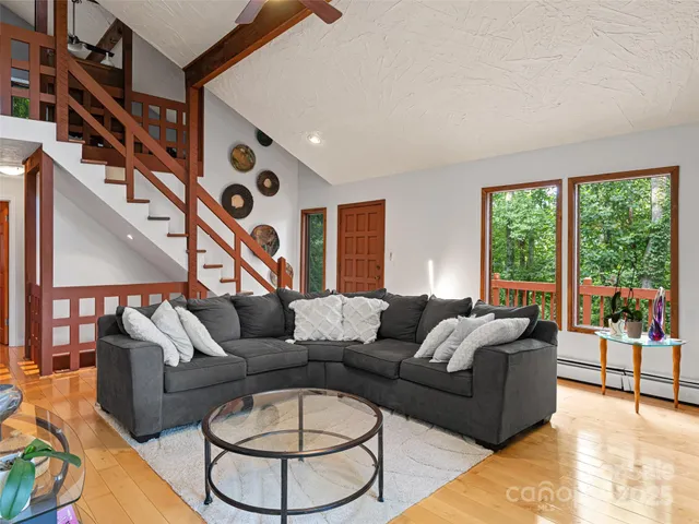 a living room with furniture and a large window
