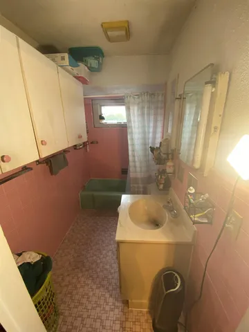 a bathroom with a sink and mirror