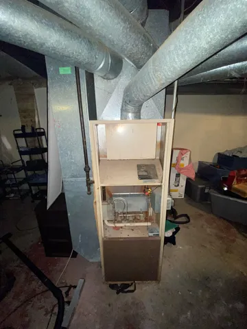 a room with water heater and storage