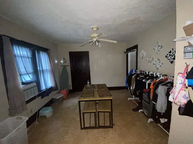 a room with gym equipment and a mirror