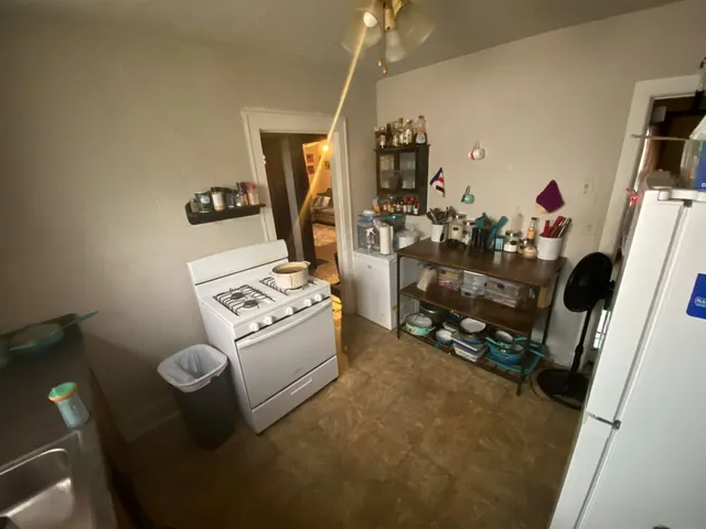 a view of living room with furniture and a flat screen tv