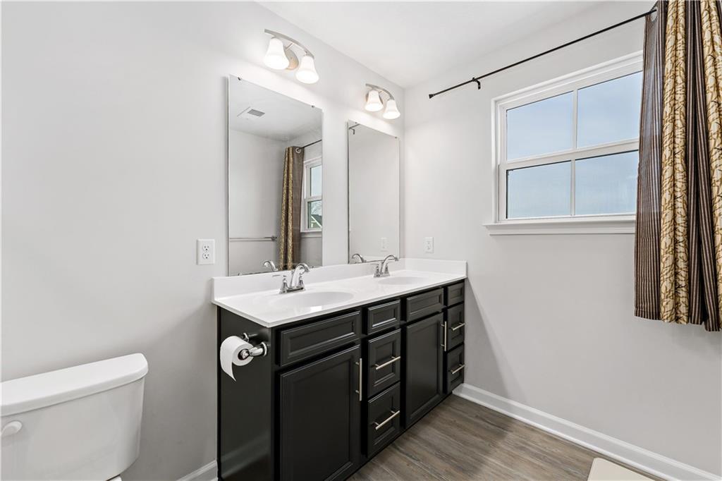 5103 Spruce Road Gibsonia, PA 15044 - Photo 18 of 50 a bathroom with a sink a toilet and vanity