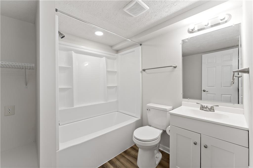 5103 Spruce Road Gibsonia, PA 15044 - Photo 25 of 50 a bathroom with a bathtub shower sink vanity and toilet