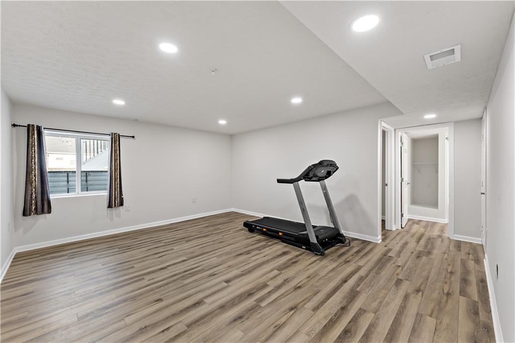 5103 Spruce Road Gibsonia, PA 15044 - Photo 29 of 50 a view of a room with gym equipment and a large window