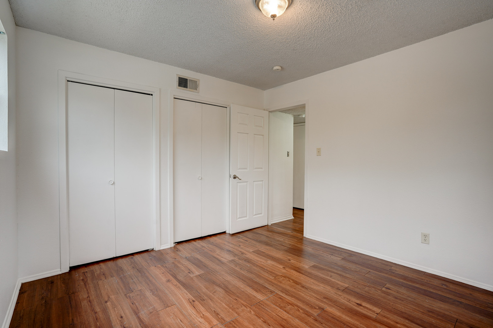 748 Old Martindale Road San Marcos, TX 78666 - Photo 12 of 18 a view of an empty room with wooden floor