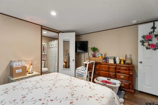 a bedroom with a bed and furniture