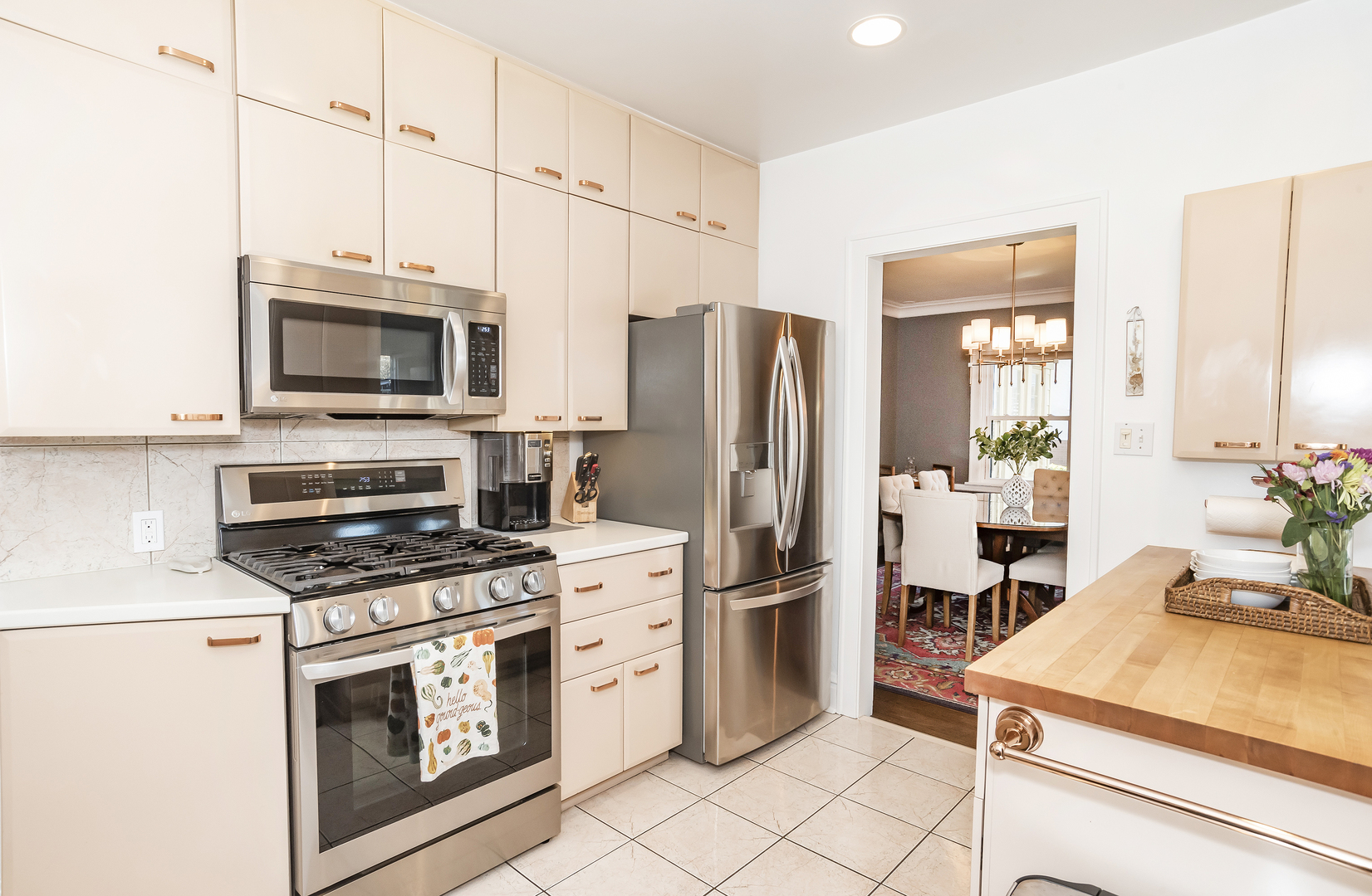 354 Robinson Court Riverside, IL 60546 - Photo 11 of 36 a kitchen with stainless steel appliances a stove microwave and refrigerator