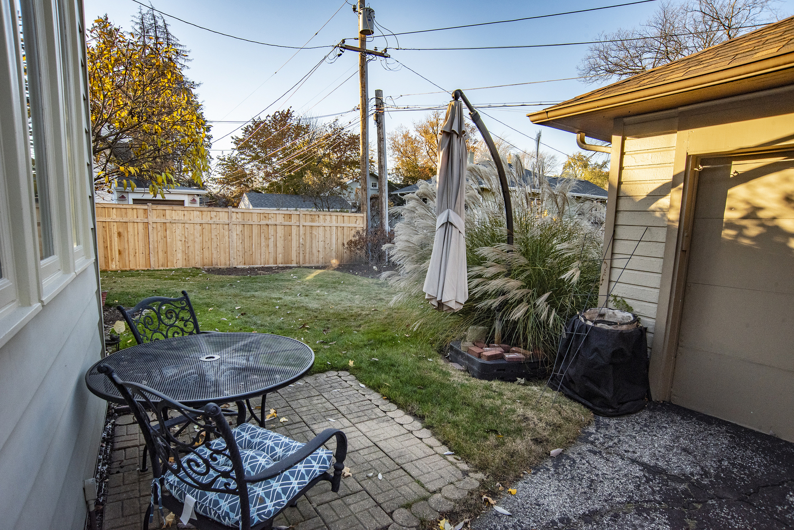 354 Robinson Court Riverside, IL 60546 - Photo 35 of 36 a view of a chairs and table in backyard of the house