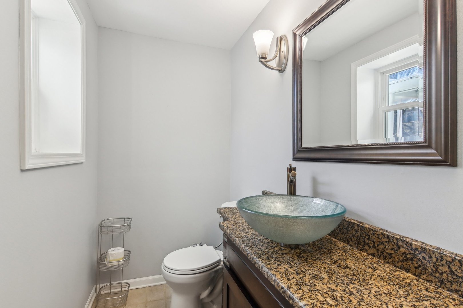 316 Bedford Road Bolingbrook, IL 60440 - Photo 24 of 38 a bathroom with a granite countertop toilet and a mirror