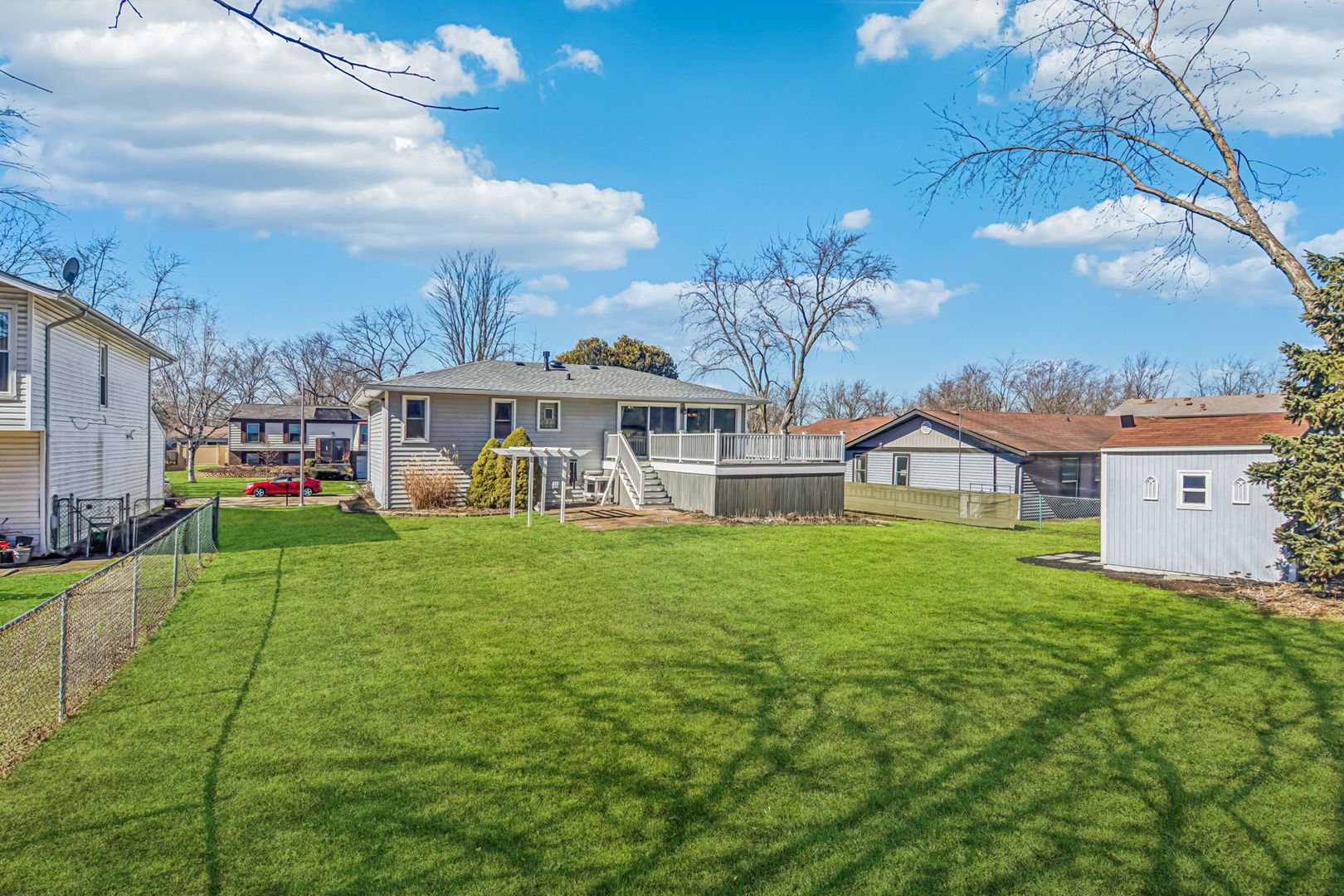316 Bedford Road Bolingbrook, IL 60440 - Photo 35 of 38 a view of a house with a big yard and large trees