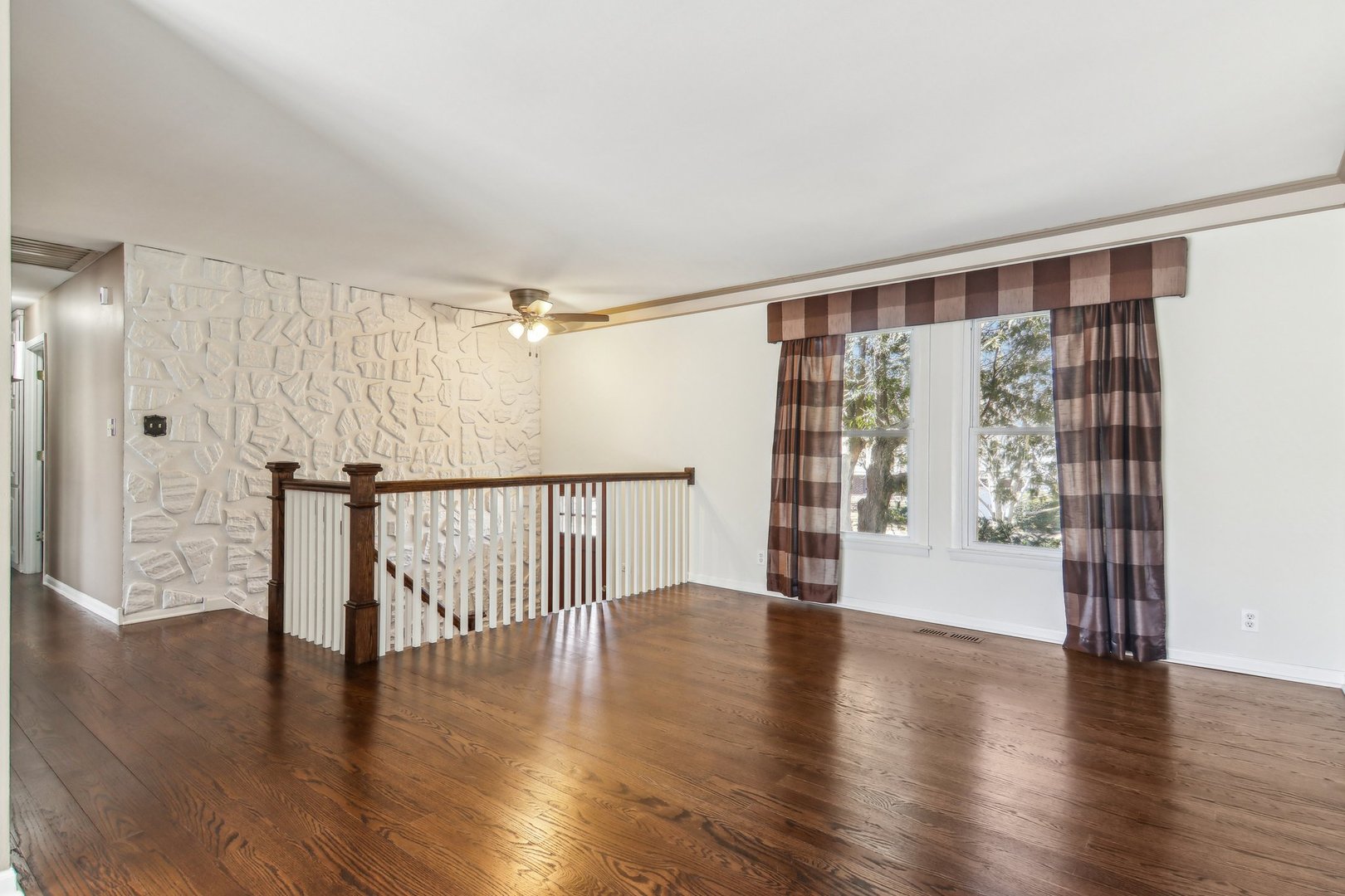 316 Bedford Road Bolingbrook, IL 60440 - Photo 6 of 38 a view of an empty room with wooden floor and a window
