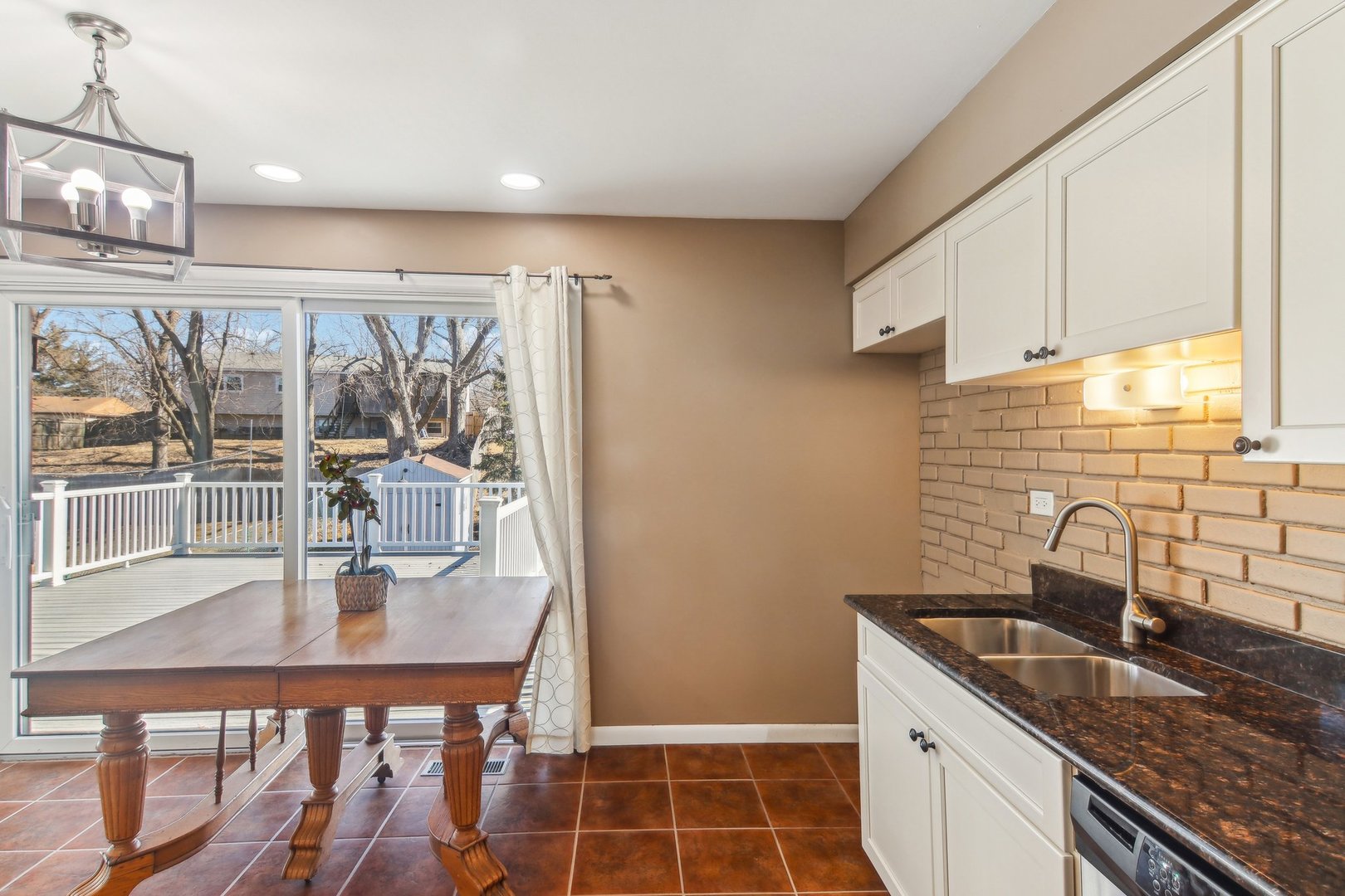 316 Bedford Road Bolingbrook, IL 60440 - Photo 10 of 38 a kitchen with granite countertop a sink and a refrigerator