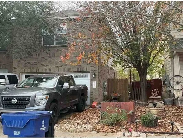 a view of a patio with table and chairs and barbeque