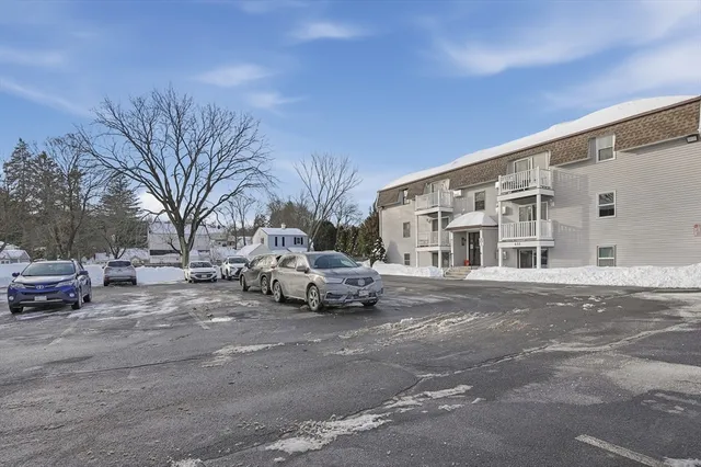a view of street with parked cars