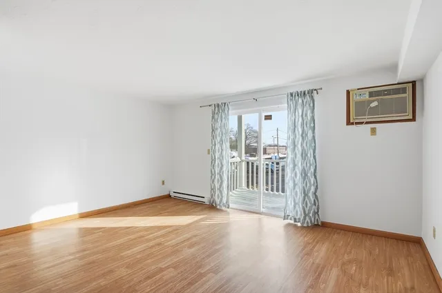 a view of a livingroom with wooden floor