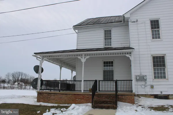 a front view of a house with stairs