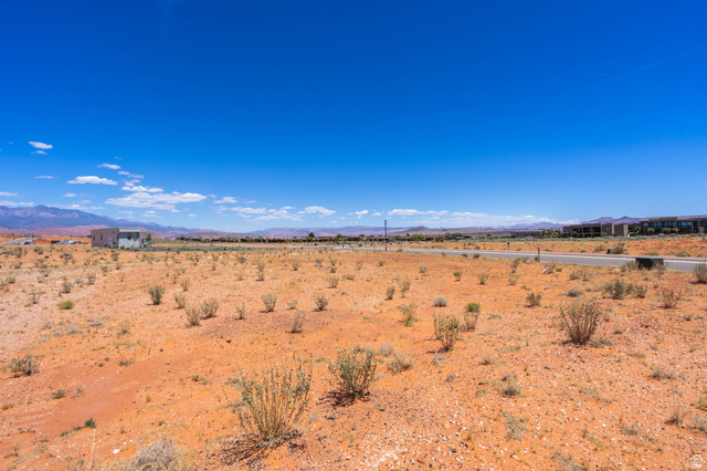 3306 South Endless Trail, Unit 33 Hurricane, UT 84737 - Photo 9 of 27 Expansive desert landscape featuring red soil and scattered low-lying vegetation