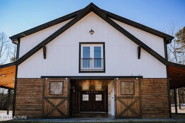 a front view of a house with glass windows