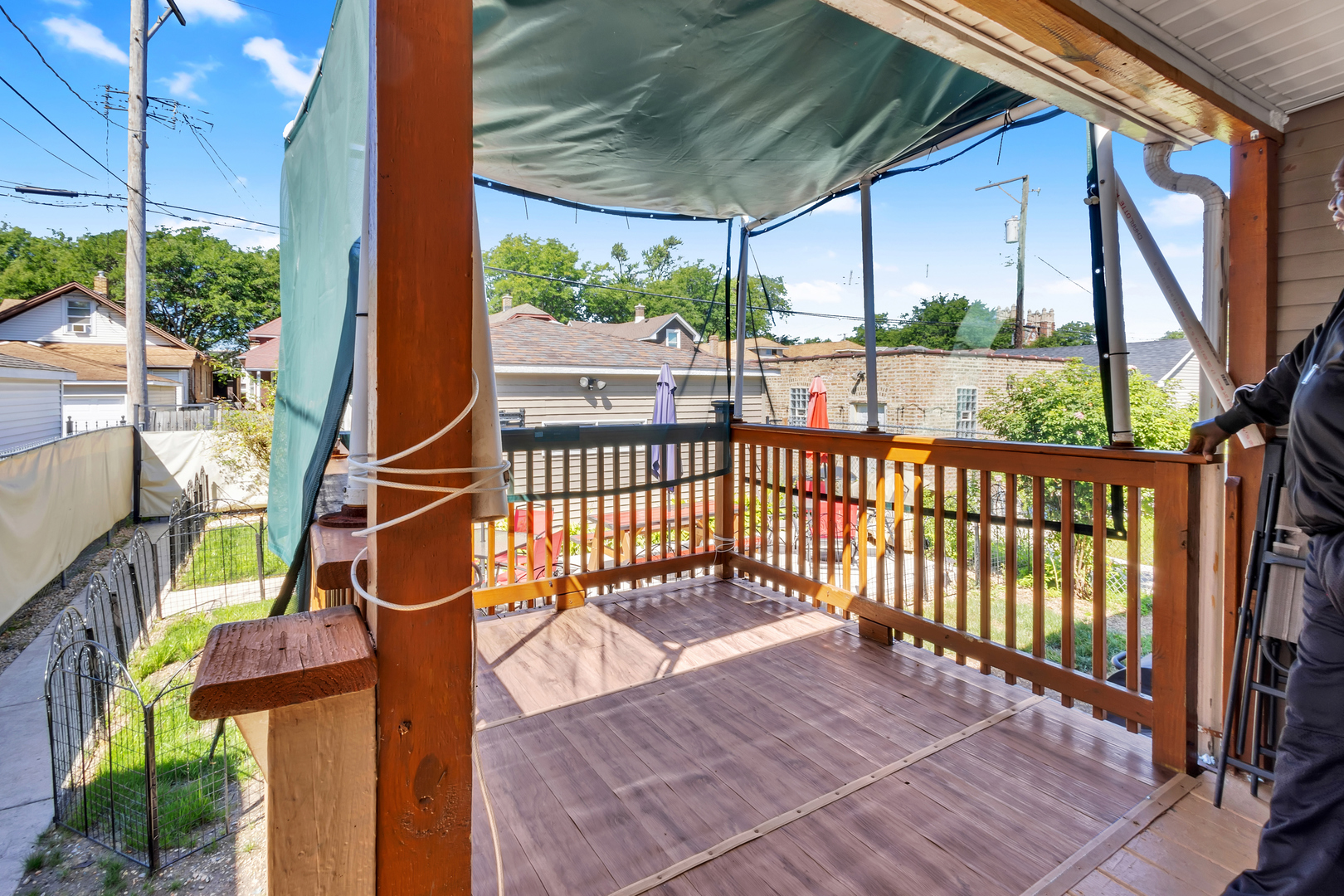 1418 North Mayfield Avenue Chicago, IL 60651 - Photo 23 of 28 a view of a porch with wooden floor and outdoor seating