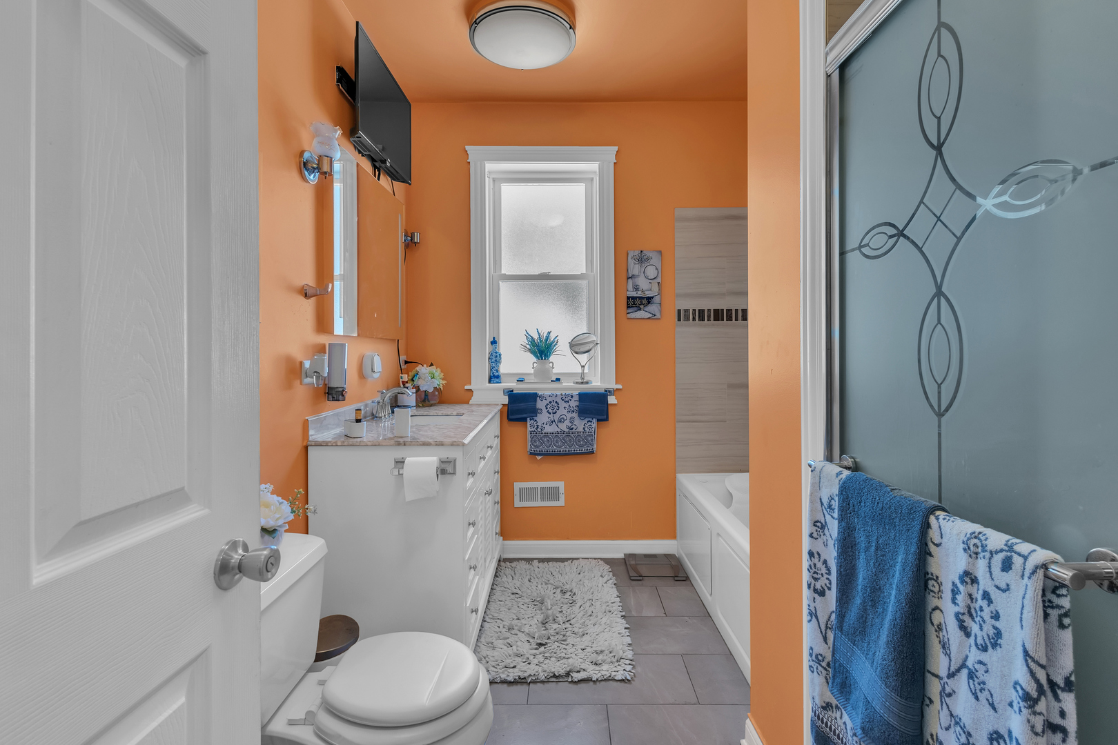 1418 North Mayfield Avenue Chicago, IL 60651 - Photo 8 of 28 a bathroom with a sink a toilet and shower