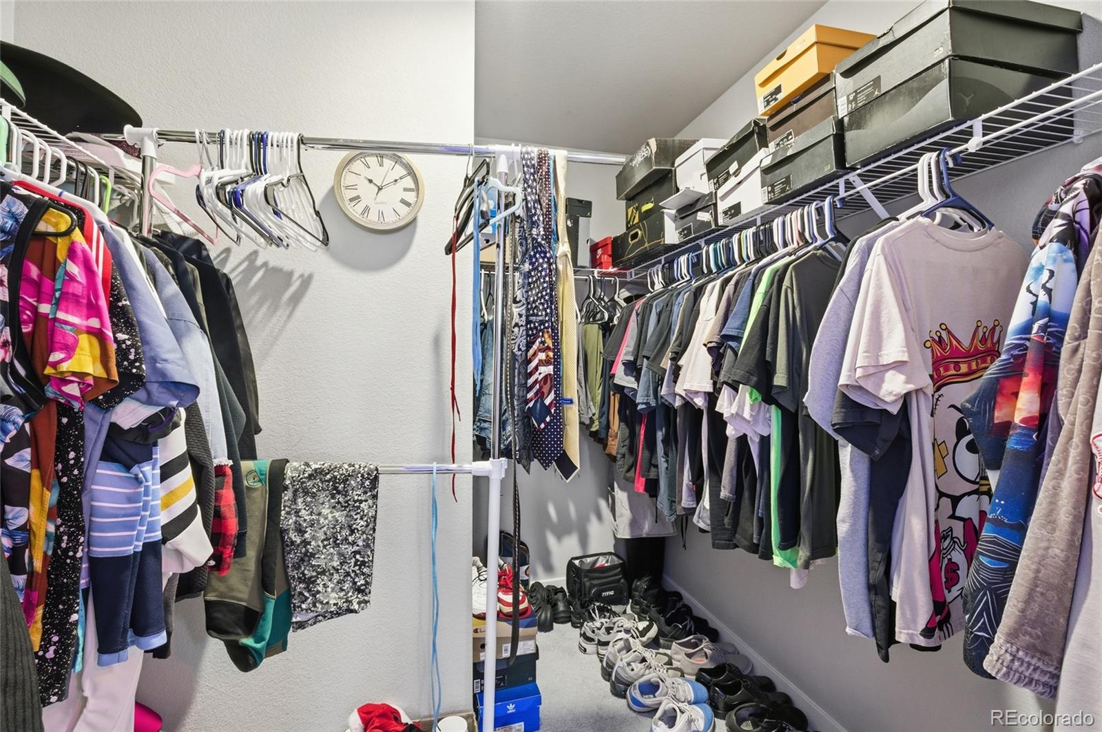 1353 Reynolds Street, Unit 11A Fort Lupton, CO 80621 - Photo 12 of 17 a view of walk in closet with clothes