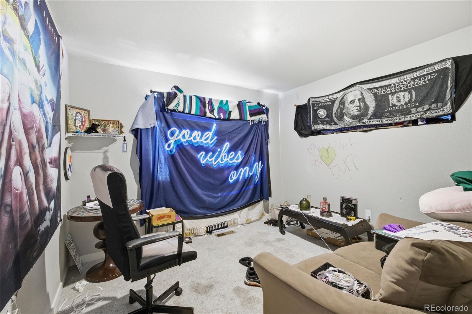 1353 Reynolds Street, Unit 11A Fort Lupton, CO 80621 - Photo 14 of 17 a living room with furniture and a window