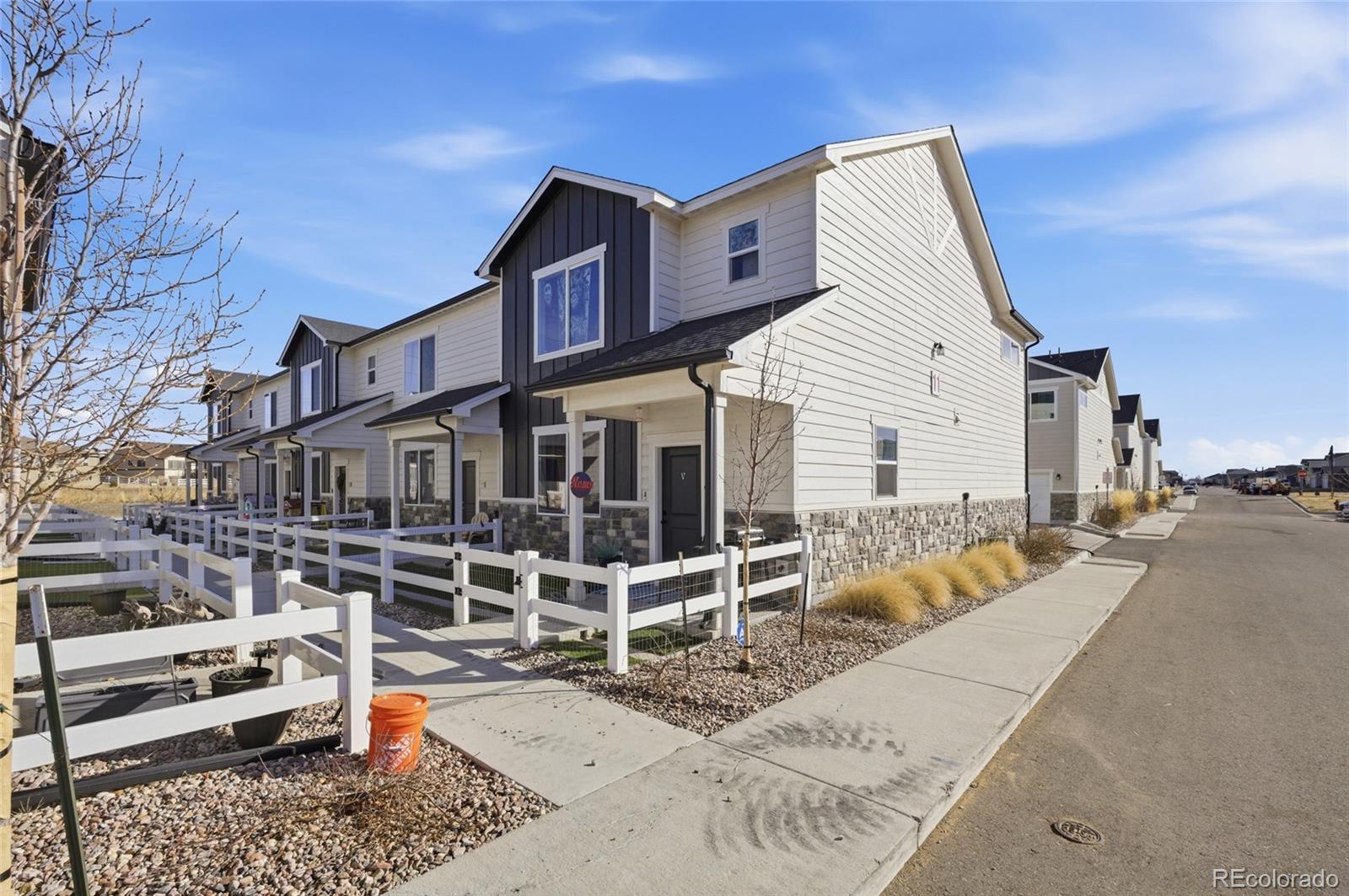1353 Reynolds Street, Unit 11A Fort Lupton, CO 80621 - Photo 16 of 17 a view of a house with a patio