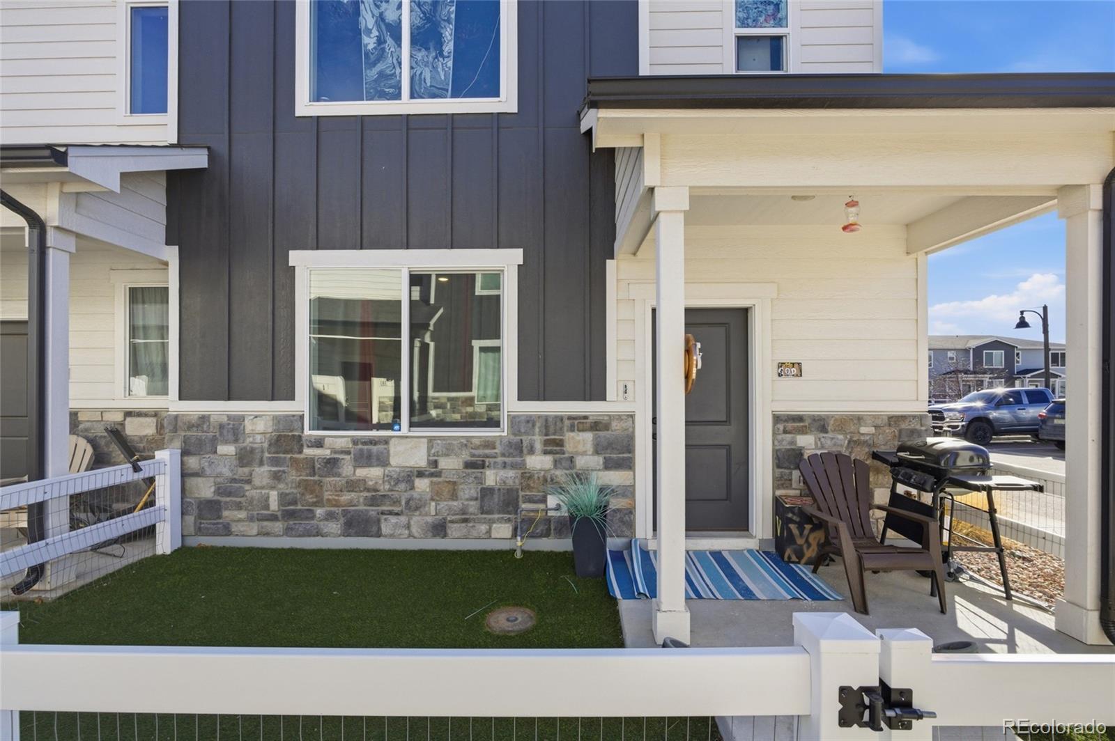 1353 Reynolds Street, Unit 11A Fort Lupton, CO 80621 - Photo 2 of 17 a view of kitchen with furniture and rug