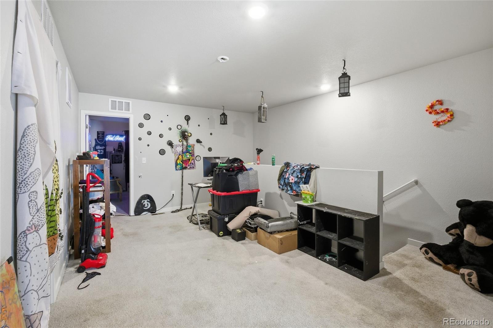 1353 Reynolds Street, Unit 11A Fort Lupton, CO 80621 - Photo 8 of 17 a view of a room with workspace and a window