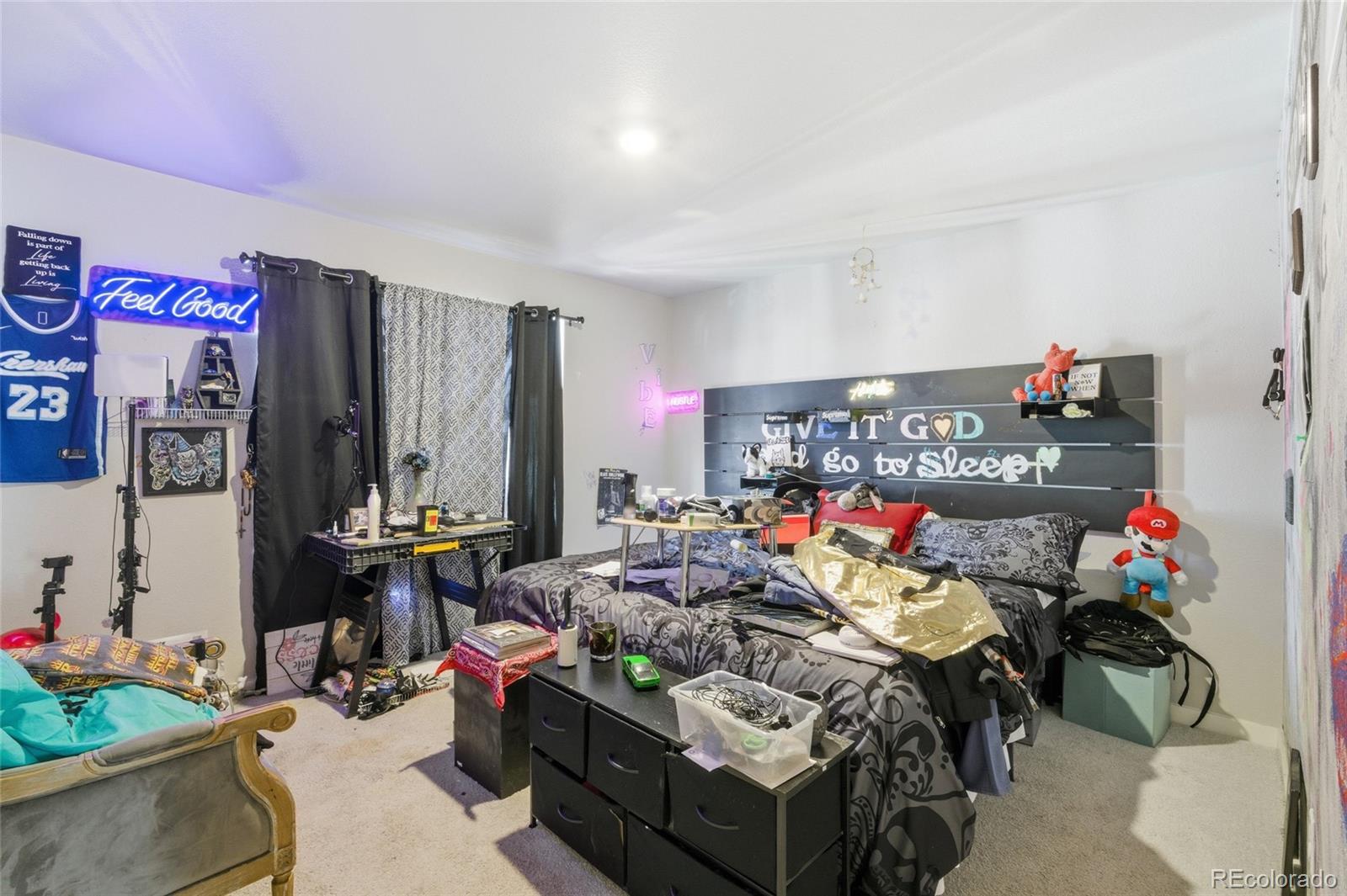 1353 Reynolds Street, Unit 11A Fort Lupton, CO 80621 - Photo 10 of 17 a bed room with a bed and a desk