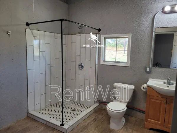 a view of a livingroom with wooden floor