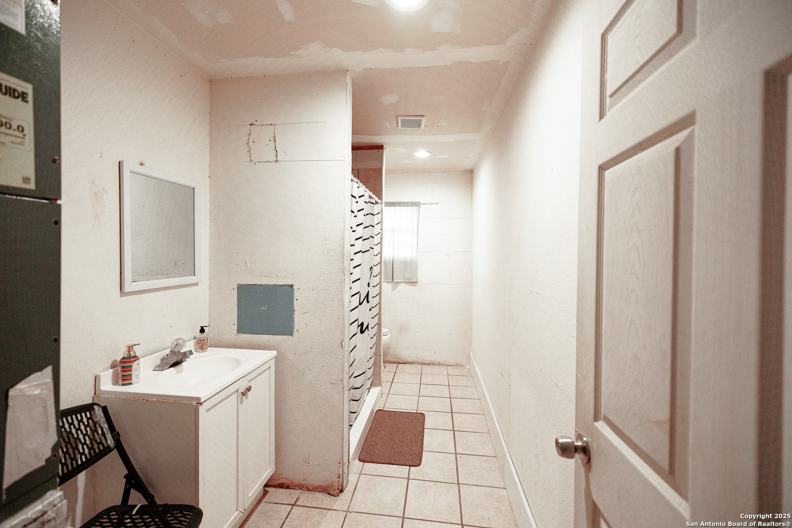 Tbd Old Pleasanton Road Poteet, TX 78264 - Photo 20 of 24 a bathroom with a sink mirror and shower