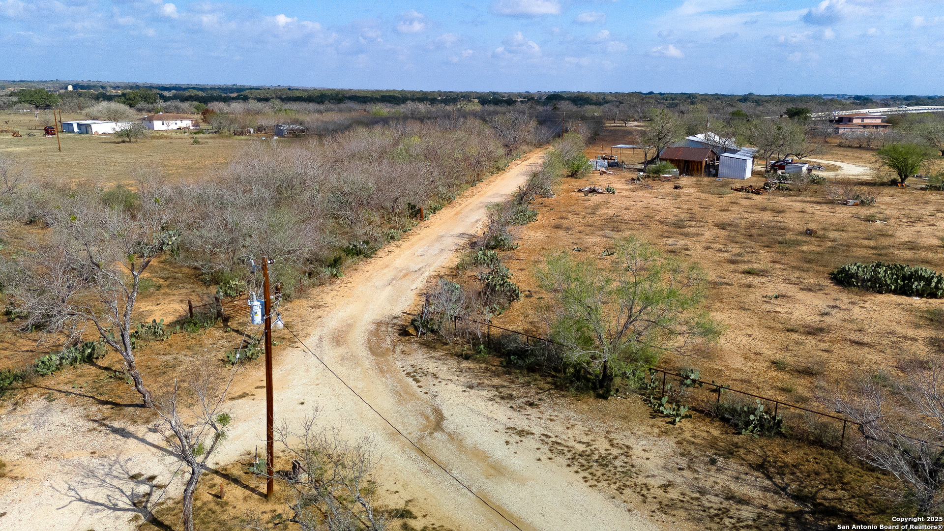 Tbd Old Pleasanton Road Poteet, TX 78264 - Photo 3 of 24 a view of a lake with a mountain in the back