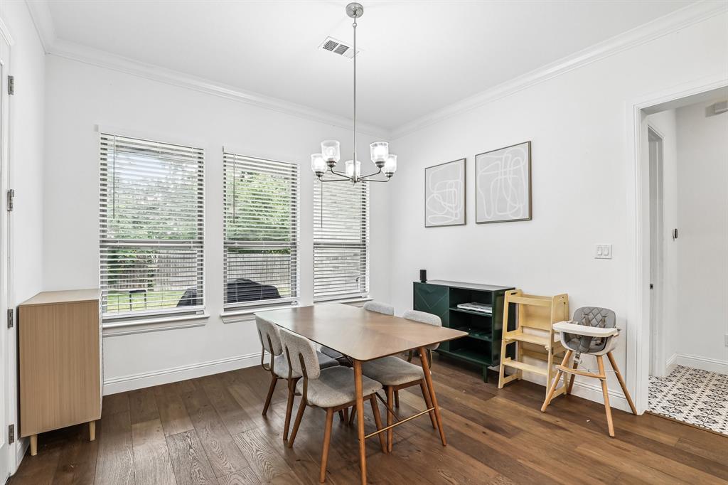 515 West Laureland Road Dallas, TX 75232 - Photo 7 of 32 a view of a dining room with furniture window and wooden floor