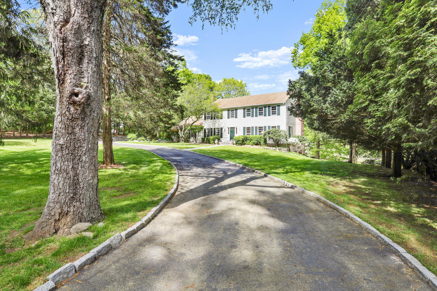 781 Valley Road New Canaan, CT 06840 - Photo 1 of 29 a view of a house with a yard