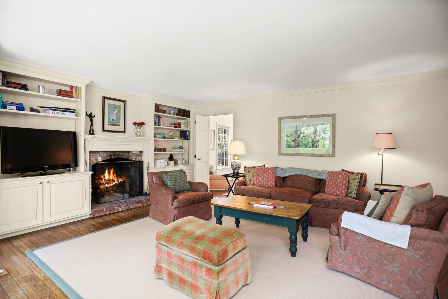 781 Valley Road New Canaan, CT 06840 - Photo 11 of 29 a living room with furniture a flat screen tv and a fireplace