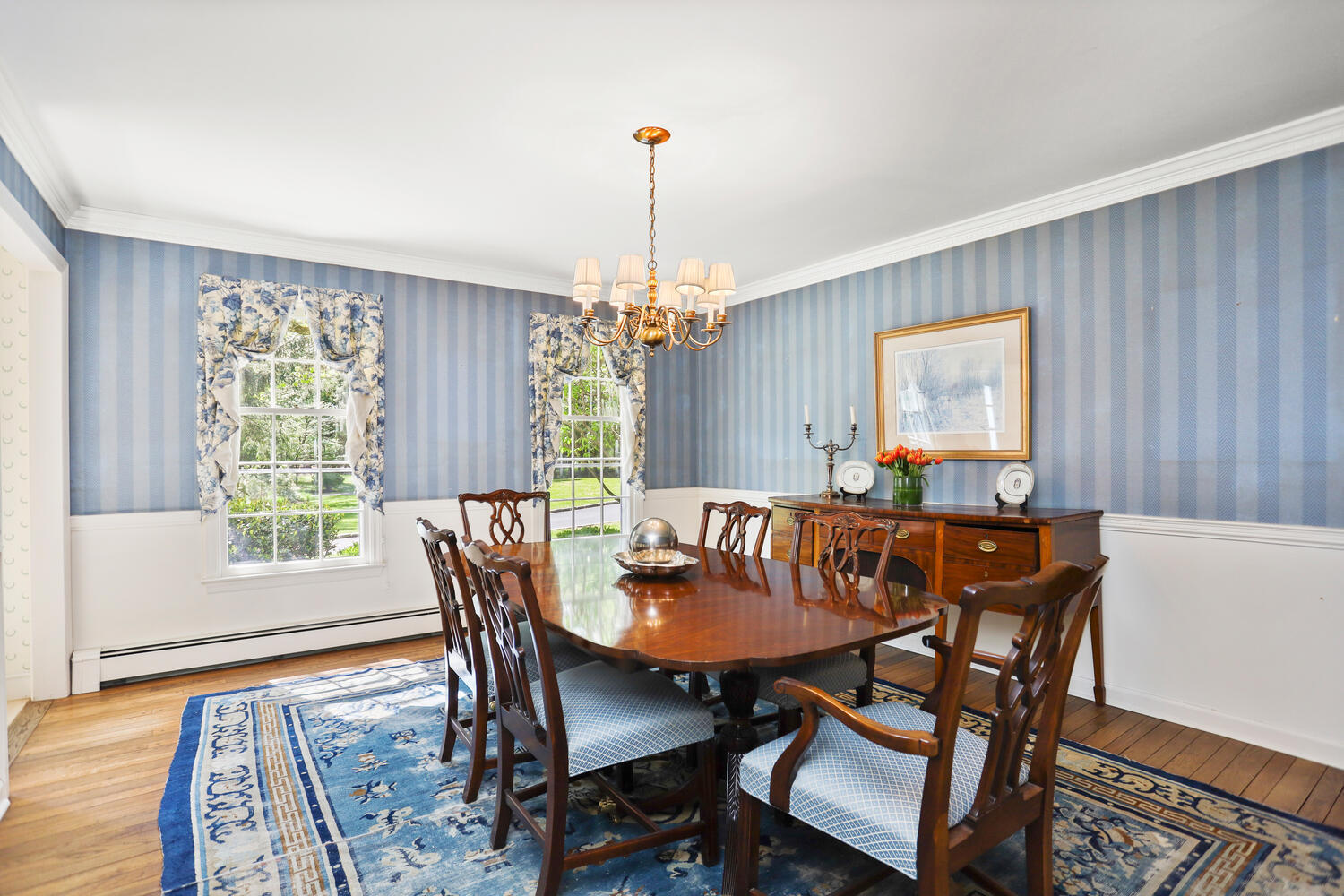 781 Valley Road New Canaan, CT 06840 - Photo 5 of 29 a dining room with furniture a chandelier and wooden floor