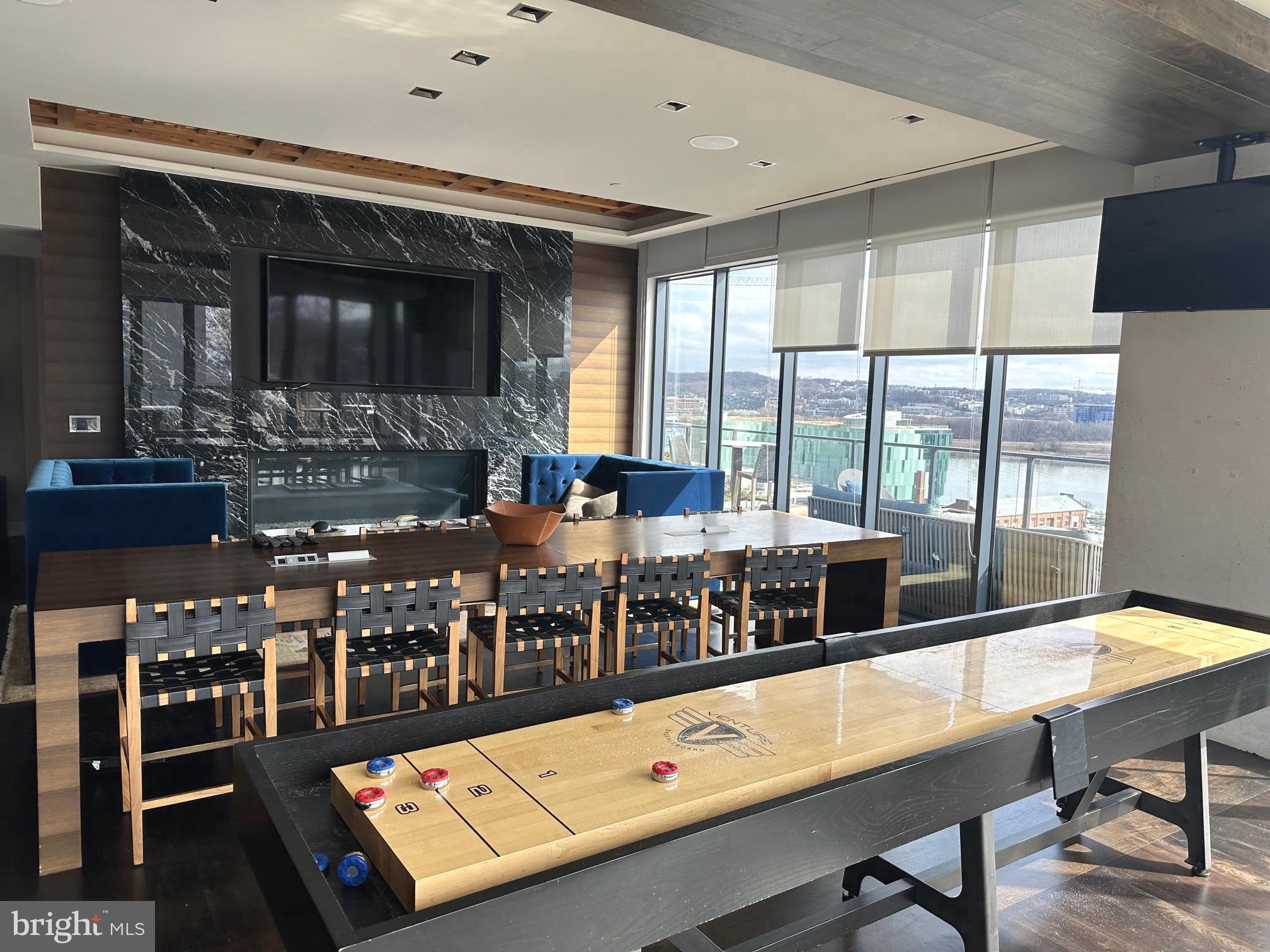 70 N Street Southeast, Unit N215 Washington, DC 20003 - Photo 12 of 16 a room with furniture pool table and flat screen tv