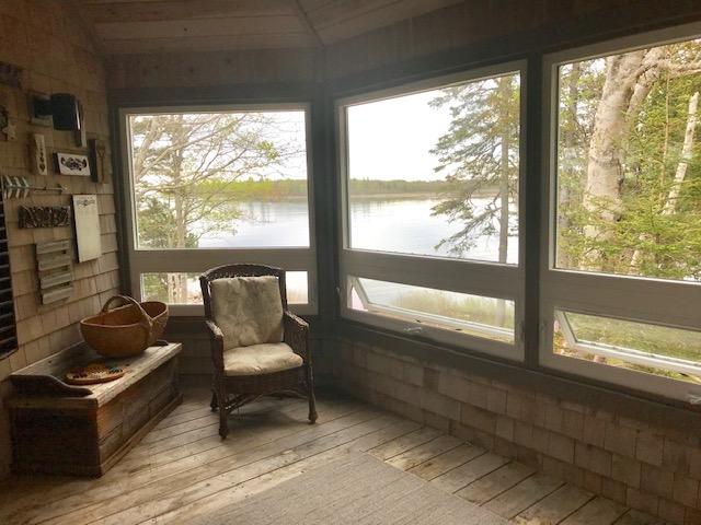 127 Paul Bunyan Road Corea, ME 04624 - Photo 12 of 46 Glassed-in porch off dining room.