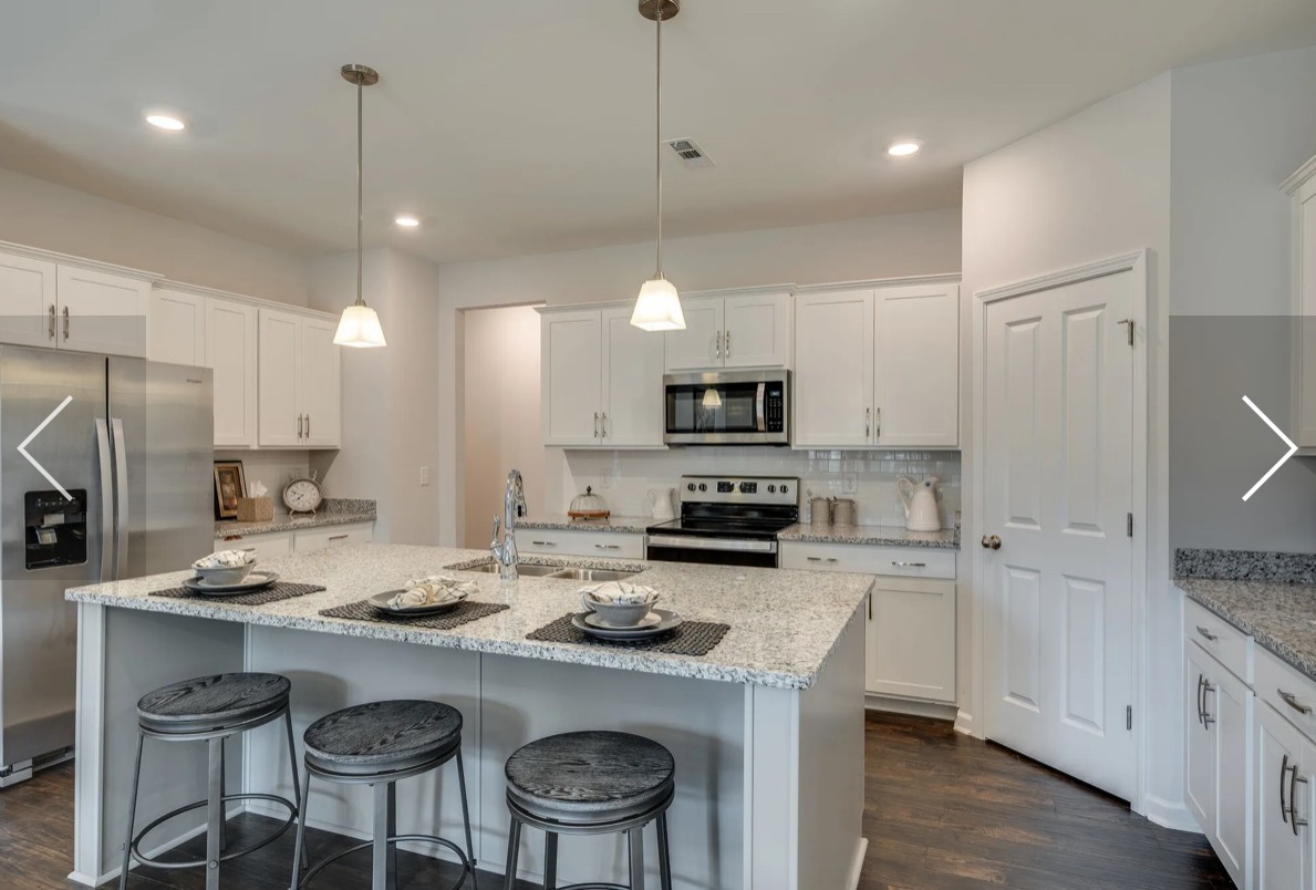 6161 Worthington Road Columbia, TN 38401 - Photo 13 of 33 a kitchen with refrigerator a stove a sink and chairs