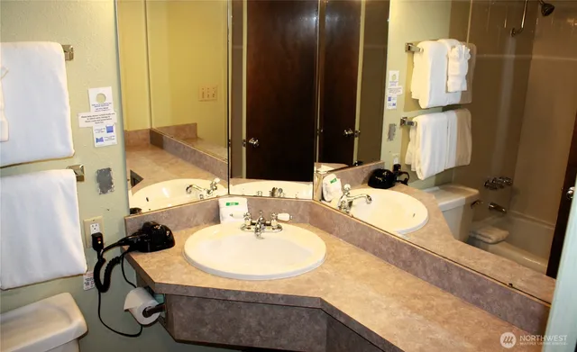 a bathroom with a sink and mirror