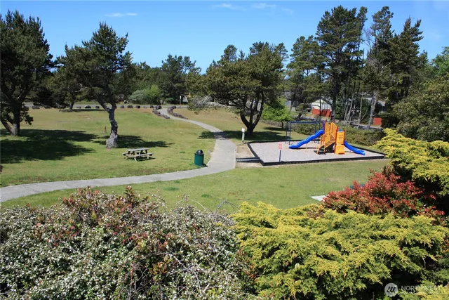 a view of a patio with table and chairs and potted plants
