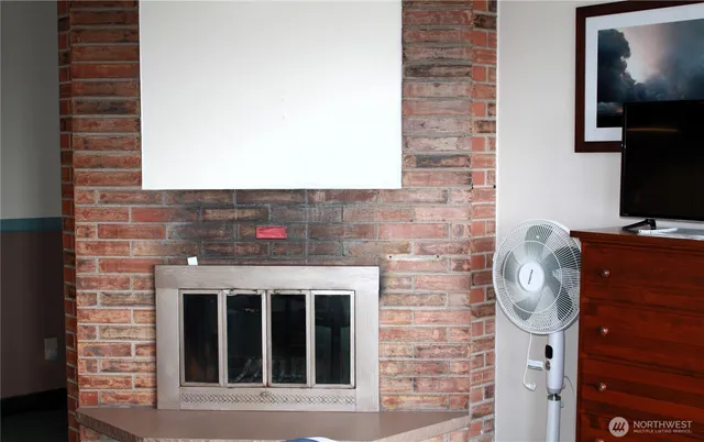 a kitchen with stainless steel appliances granite countertop a sink stove and microwave