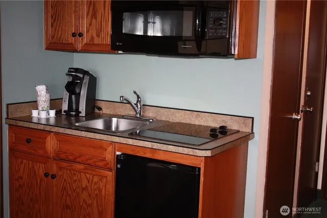 a view of living room with furniture and a large window