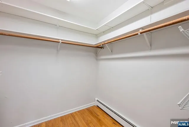 a view of a room with shelf on the wall